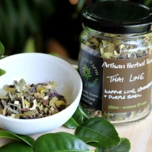 Thai Lime Sunrise Herbal tea jar with its fresh ingredients and dried loose leaf